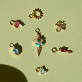 solid gold earring charms displayed on hard surface including the Amazonite, Diamond & Moonstone Eye Earring Charm 9k Gold