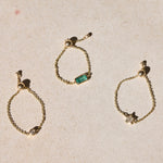solid gold chain rings on hard surface including the Diamond Star Chain Ring 9k Gold