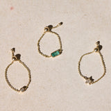 solid gold chain rings on hard surface including the Diamond Star Chain Ring 9k Gold