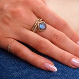 model hand wearing solid gold ring stack including the Diamond Star Chain Ring 9k Gold