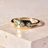 close up of the Diamond Starburst Ring 9k Gold on marble surface