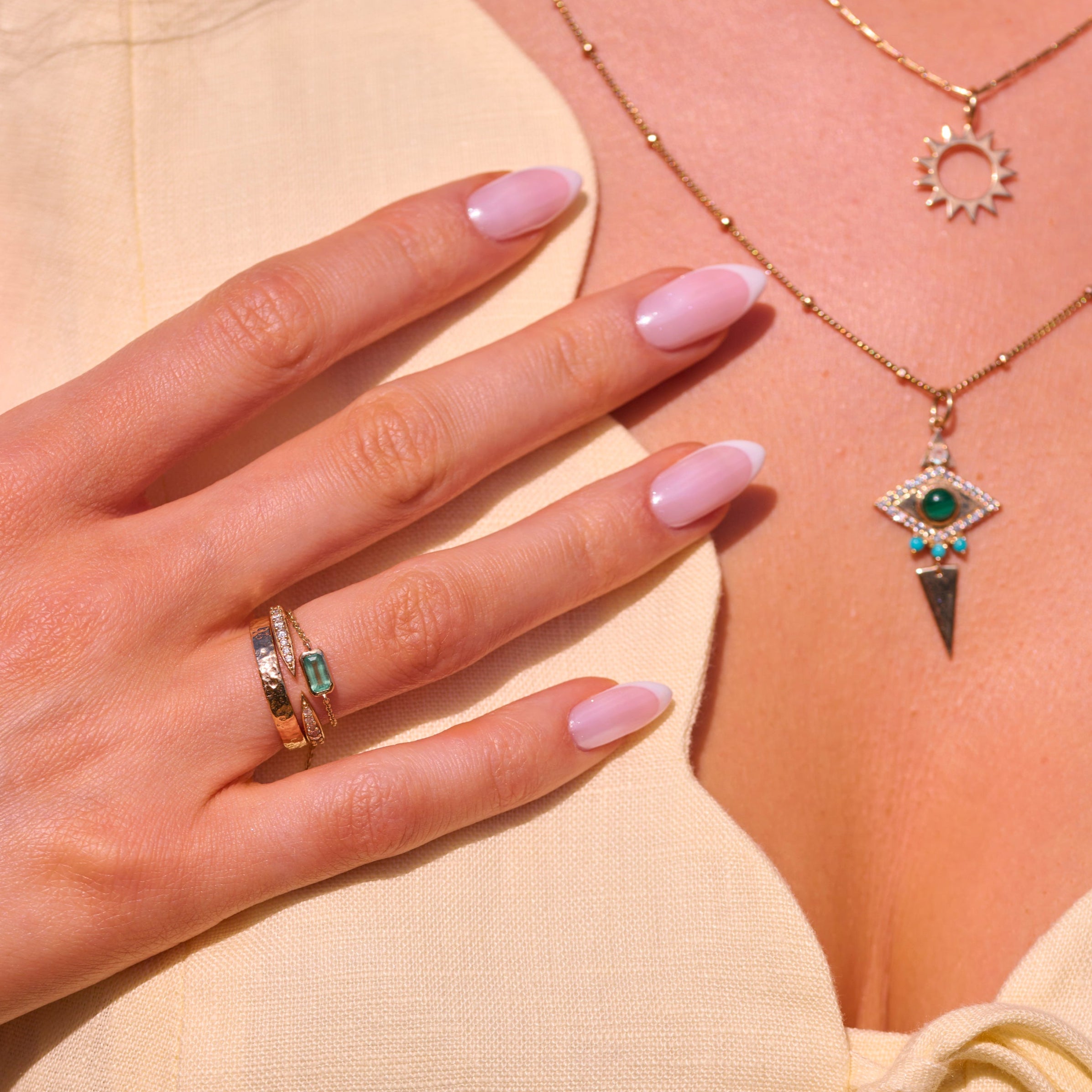 model showing solid gold jewellery including the Emerald Chain Ring 9k Gold