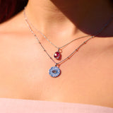 close up of model wearing sterling silver necklaces including the Labradorite & White Sapphire Eye Coin Pendant Sterling Silver