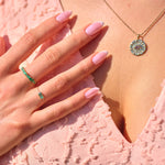 model wearing solid gold jewellery including the Labradorite & Diamond Eye Coin Necklace 9k Gold