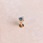 London Blue Topaz & Diamond Arrow Flat Back 9k Gold on hard surface