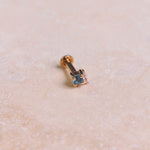 London Blue Topaz & Diamond Arrow Flat Back 9k Gold on marble surface