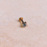 London Blue Topaz & Diamond Arrow Flat Back 9k Gold on marble surface