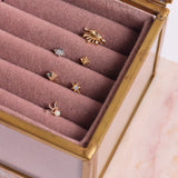 solid gold flat back collection in jewellery box including the London Blue Topaz & Diamond Arrow Flat Back 9k Gold