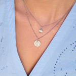 silver necklaces on model