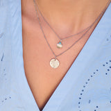 silver necklaces on model