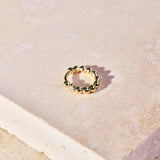 Mini Diamond Beaded Huggie Hoop 9k Gold on hard surface
