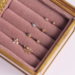 Opal Star Flat Back Earring 14k Gold in pink jewellery box along with other solid gold earrings