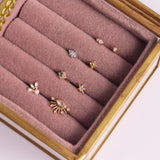 Opal Star Flat Back Earring 14k Gold in pink jewellery box along with other solid gold earrings