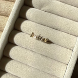 Gold ring with 'India' in ring box