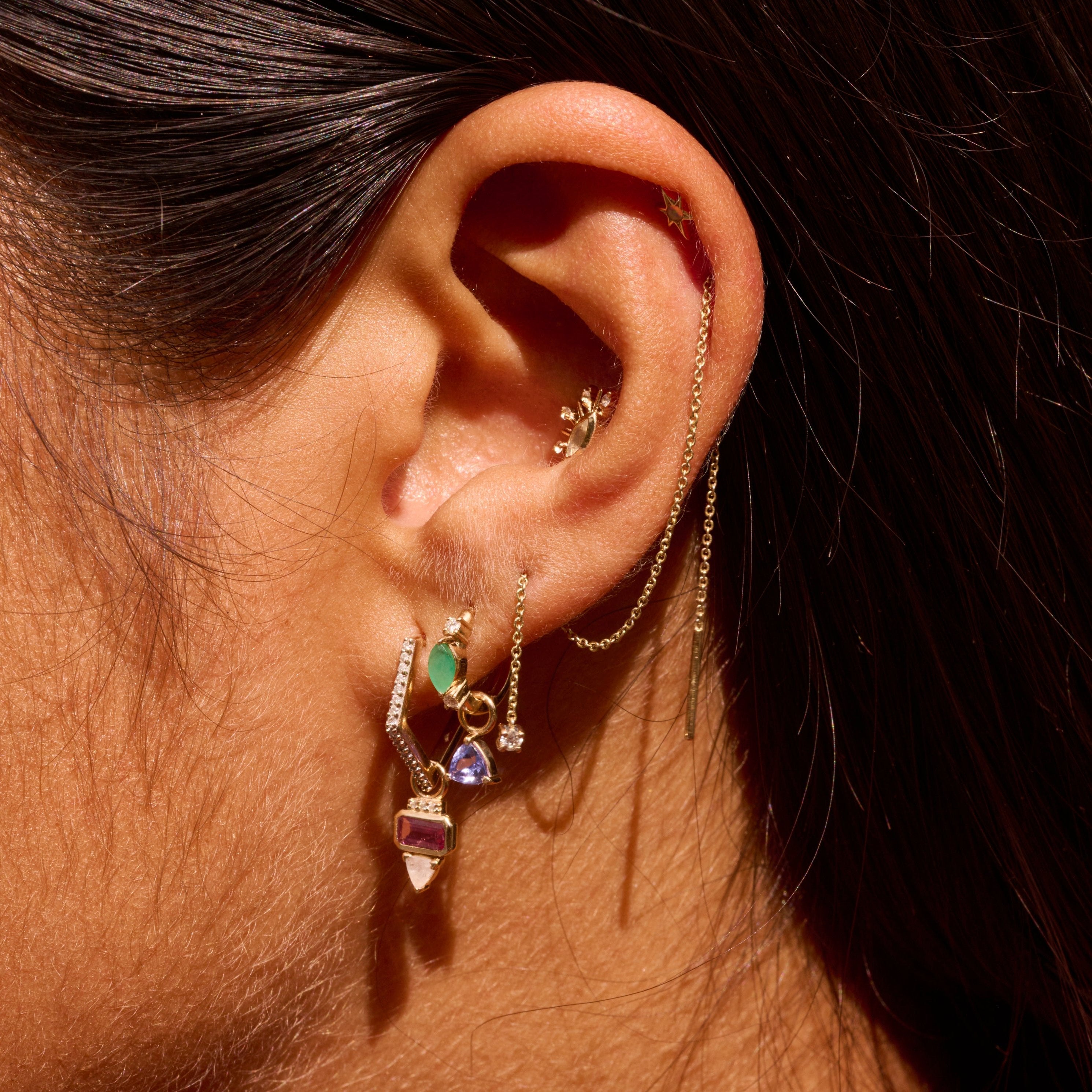 close up of ear stack including the Pink Tourmaline, Diamond & Moonstone Earring Charm 9k Gold