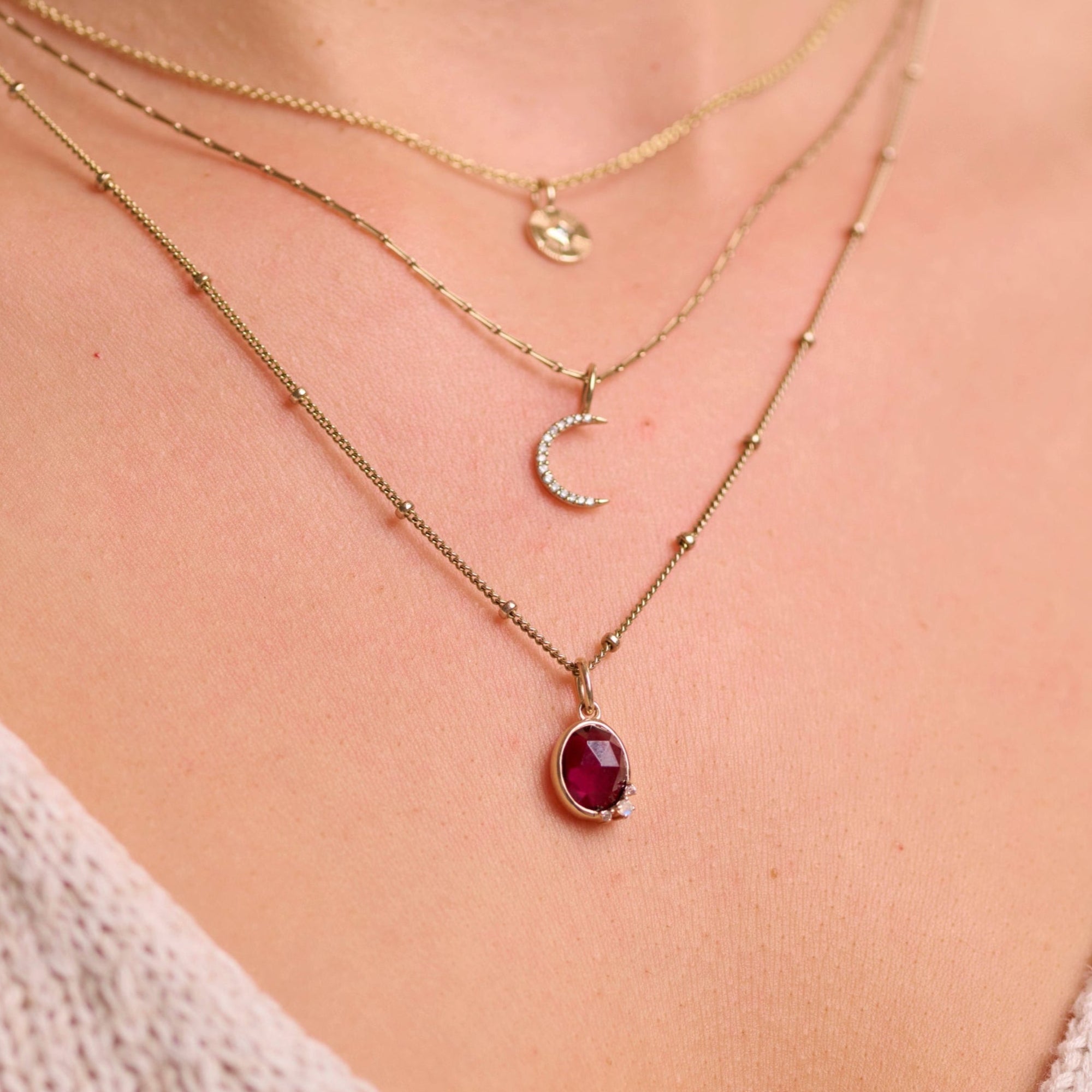 solid gold necklaces layered including the Rhodolite Garnet, Moonstone & White Sapphire Necklace 9k Gold