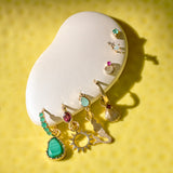 gold hoops on yellow background
