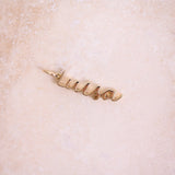 Name Pendant 9k Gold on hard surface