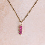 Personalised Birthstone Trio Pendant 9k Gold attached to a gold chain