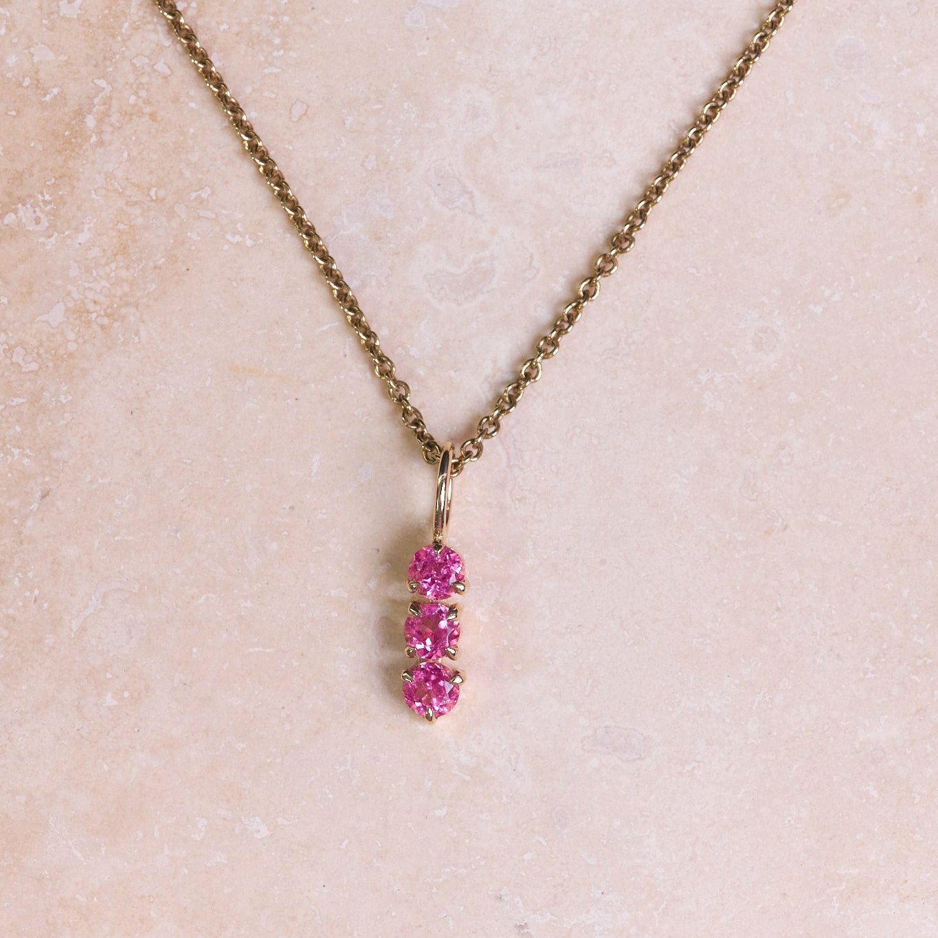 Personalised Birthstone Trio Pendant 9k Gold attached to a gold chain
