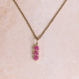 Personalised Birthstone Trio Pendant 9k Gold attached to a gold chain