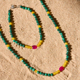 beaded jewellery on sand