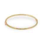 Gold bangle on a white background