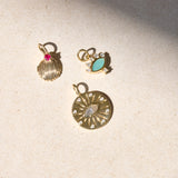 solid gold pendants on stone