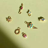 gold charms on green surface