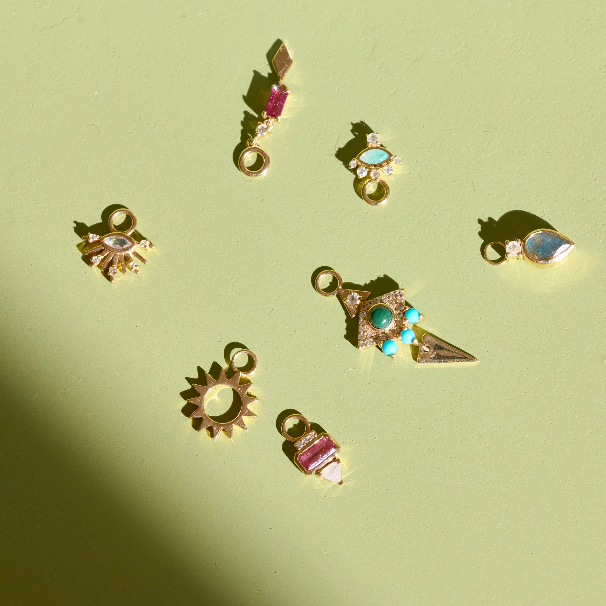 gold charms on green surface