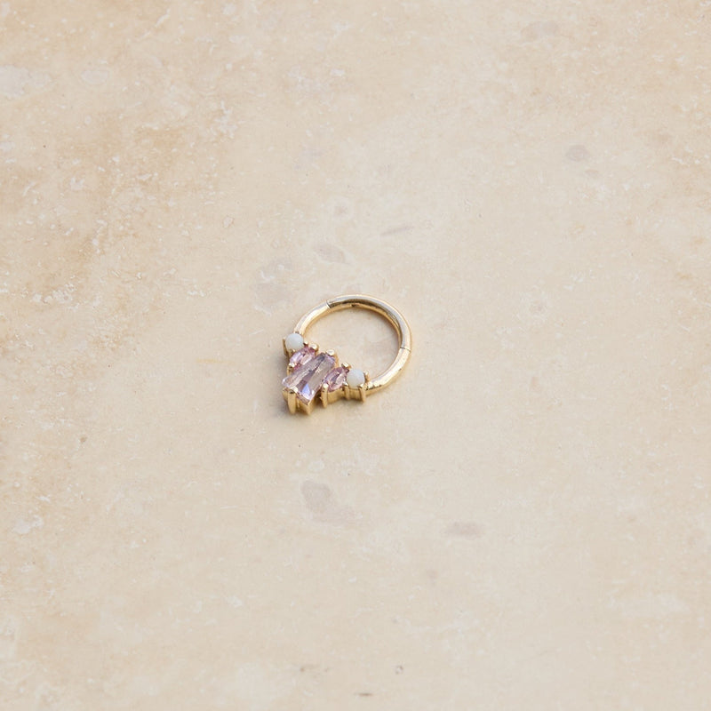 Pink Tourmaline, Sapphire & Opal Daith Earring 9k Gold on hard surface