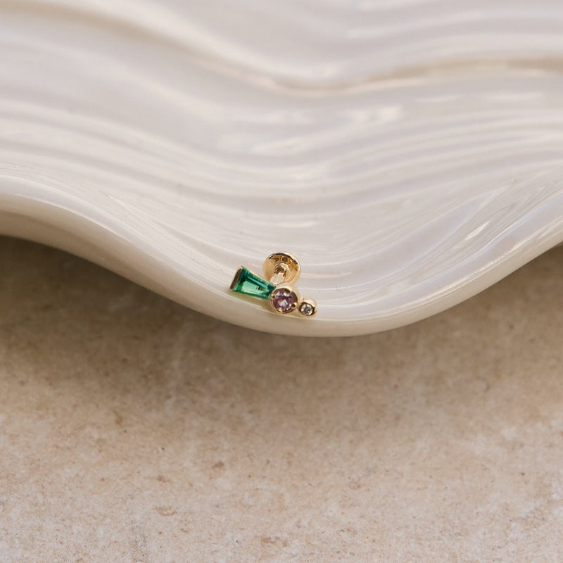 Emerald, Sapphire & Diamond Flat Back Earring 14k Gold on a ceramic surface