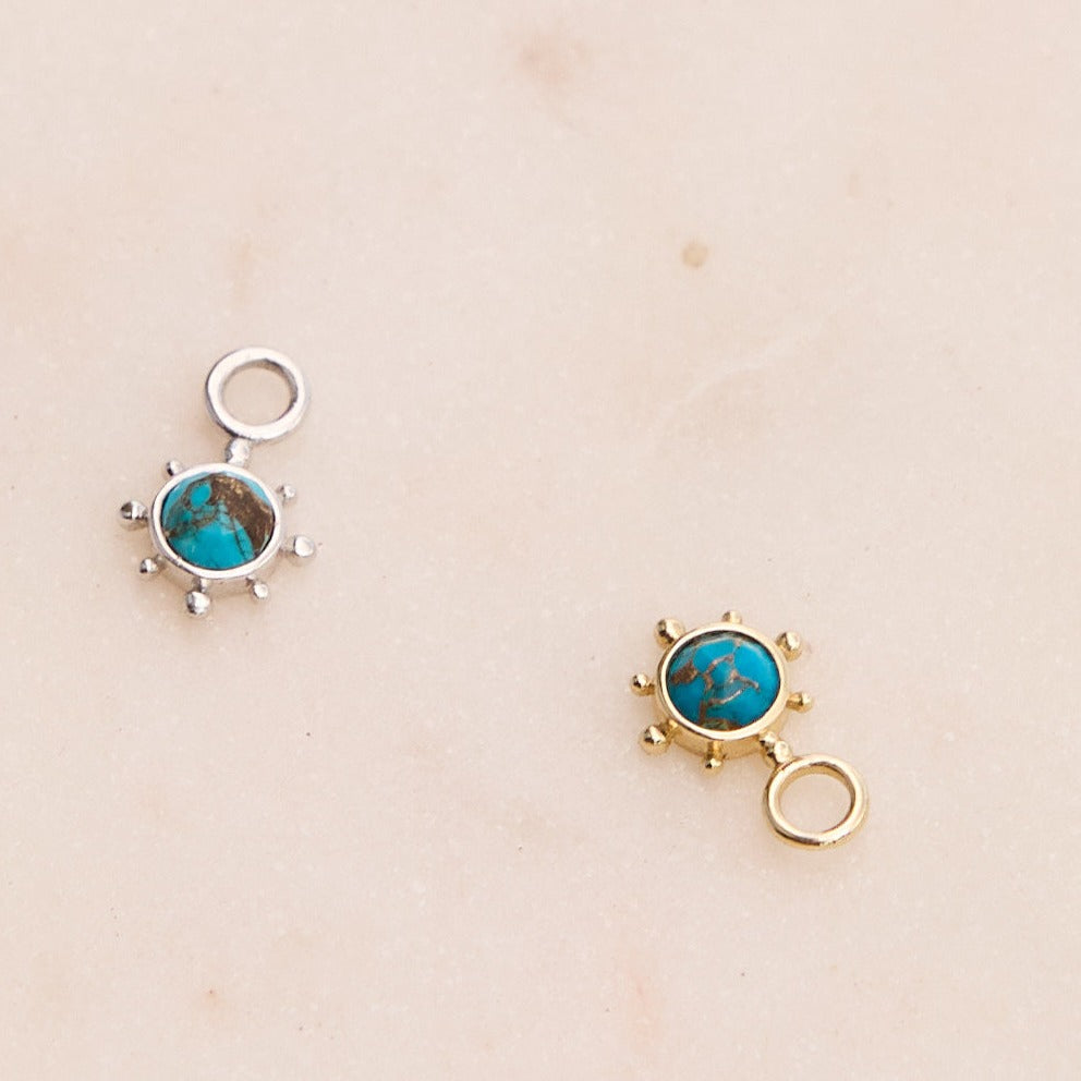 Copper Turquoise Earring Charm 9k Gold and sterling silver on hard surface