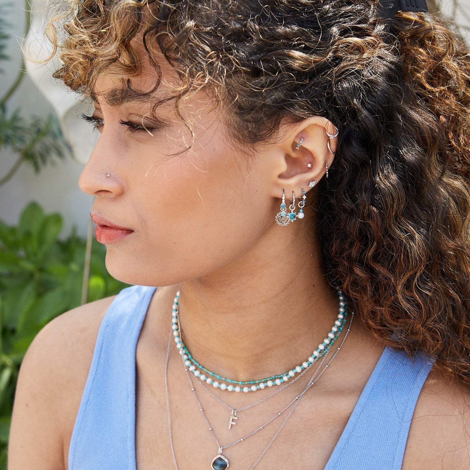 model wearing sterling silver pieces including the Copper Turquoise Hoop Earring Sterling Silver