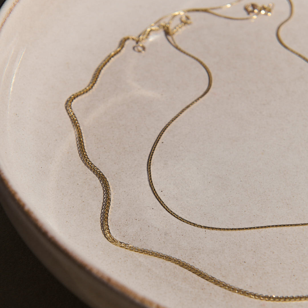 gold chains on a bowl