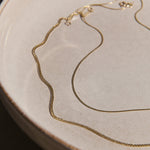 gold chains on a bowl