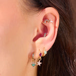 natural stone gold jewellery on models ear
