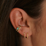 model wearing gold ear stack including the Amazonite & White Sapphire Ear Cuff 14k Gold Vermeil