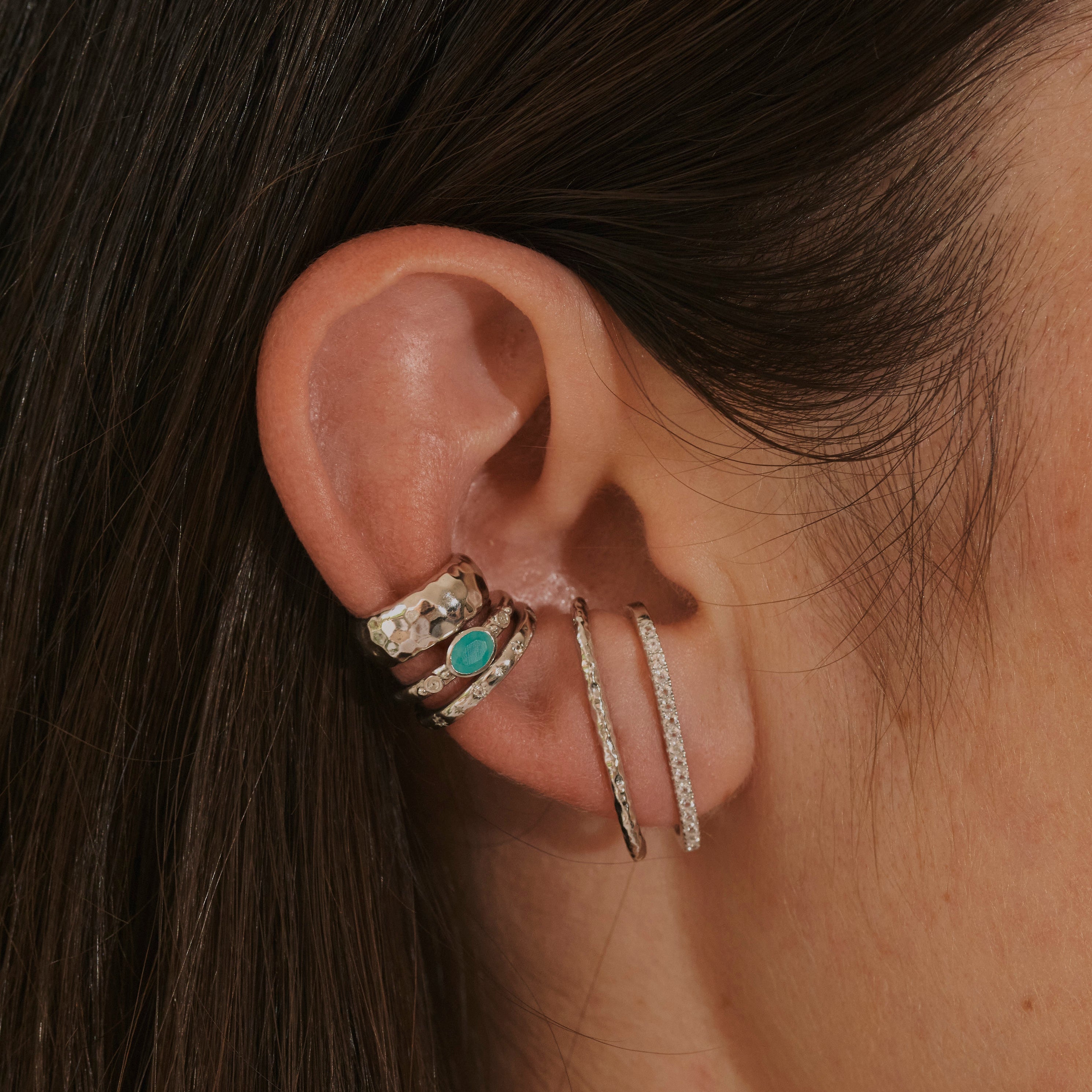 close up of model ear wearing silver stack including the Amazonite & White Sapphire Ear Cuff Sterling Silver