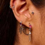 close up of sterling silver ear stack including the Amethyst & White sapphire Huggie Hoop Earring Sterling Silver