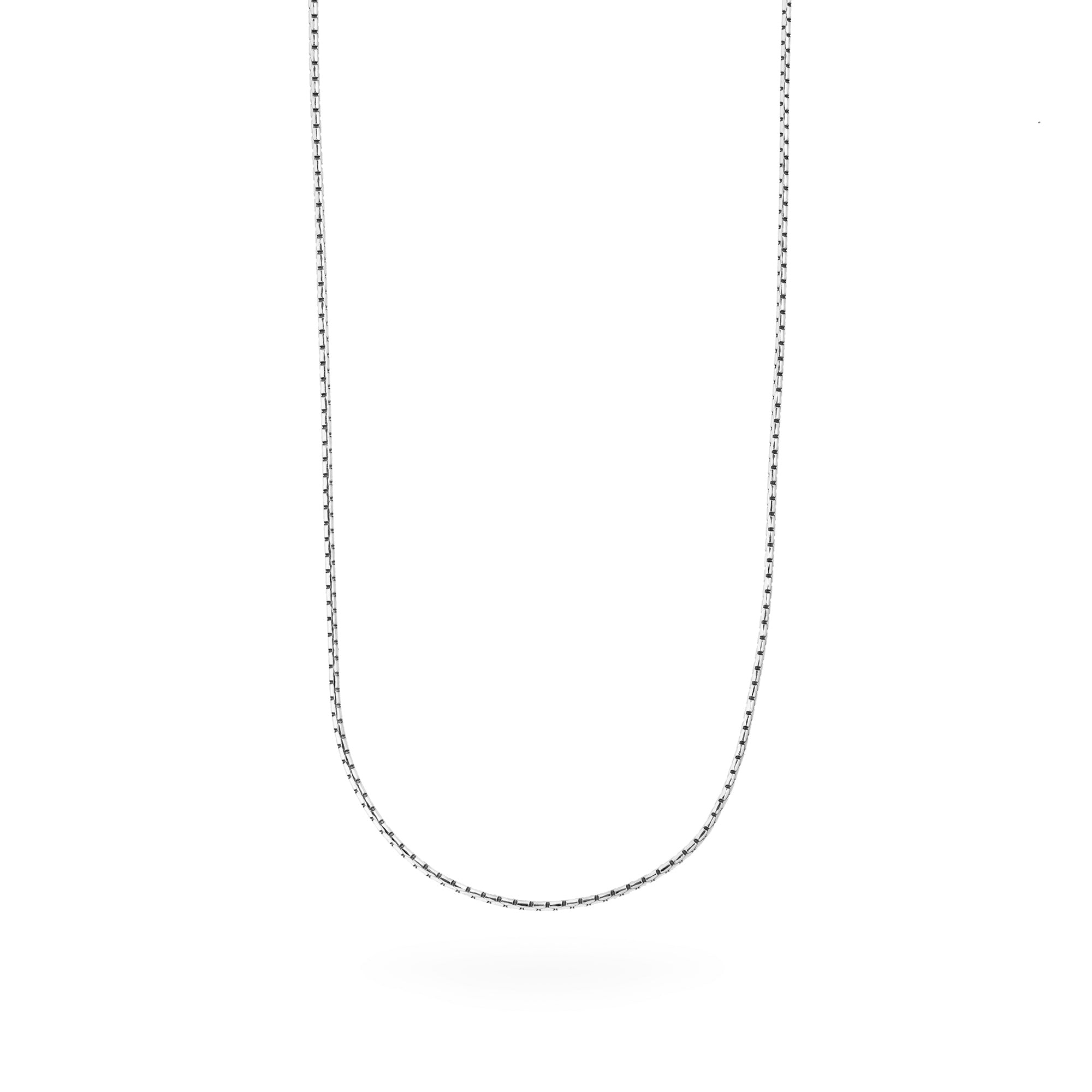 white gold chain necklace on a white background