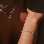 model wearing the Beaded Bracelet Sterling Silver and matching beaded necklace
