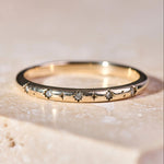 Celestial Diamond Band Ring 9k Gold on hard surface