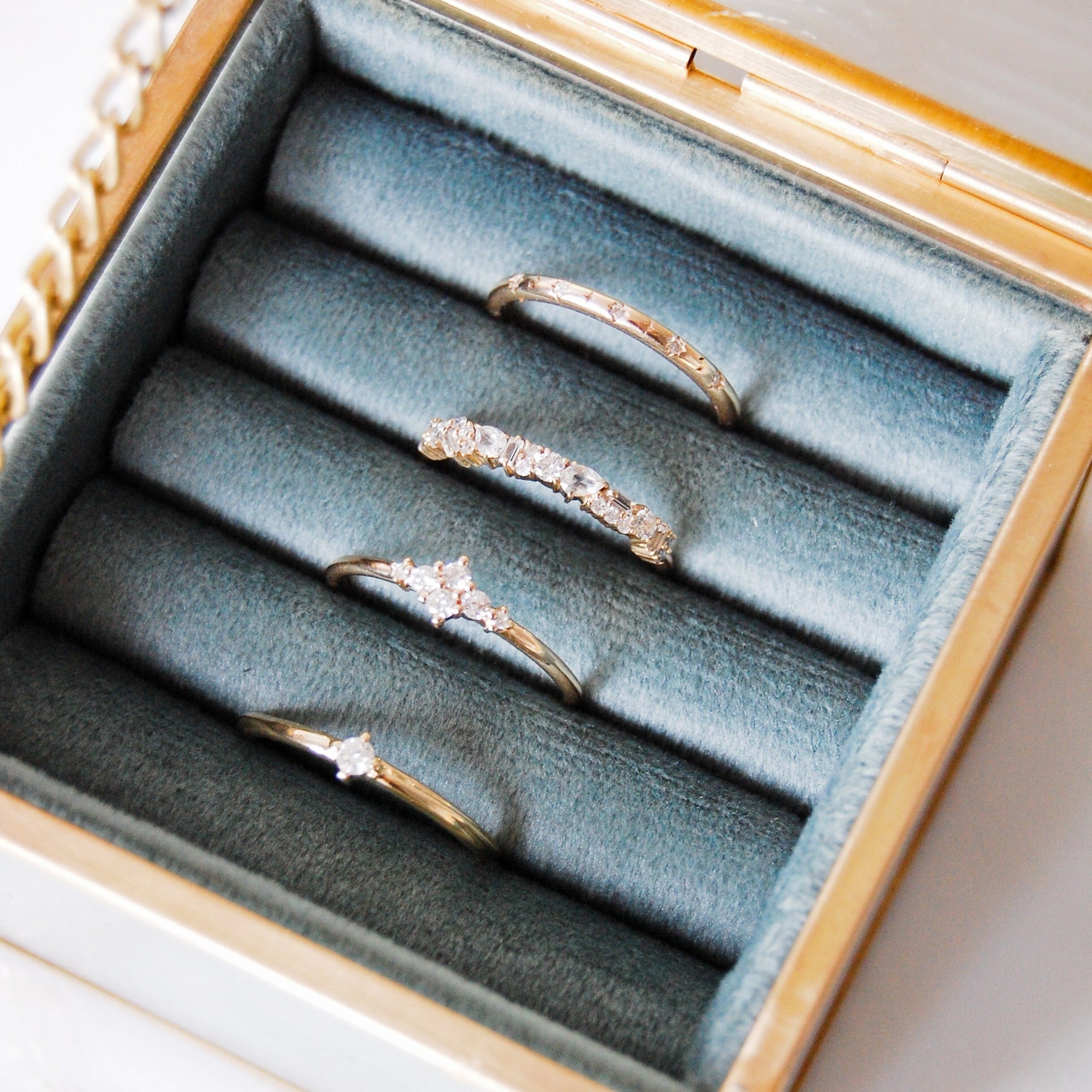 solid gold rings in ring box including the Celestial Diamond Band Ring 9k White Gold