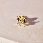Celestial Diamond Star Stud 9k Gold on marble surface