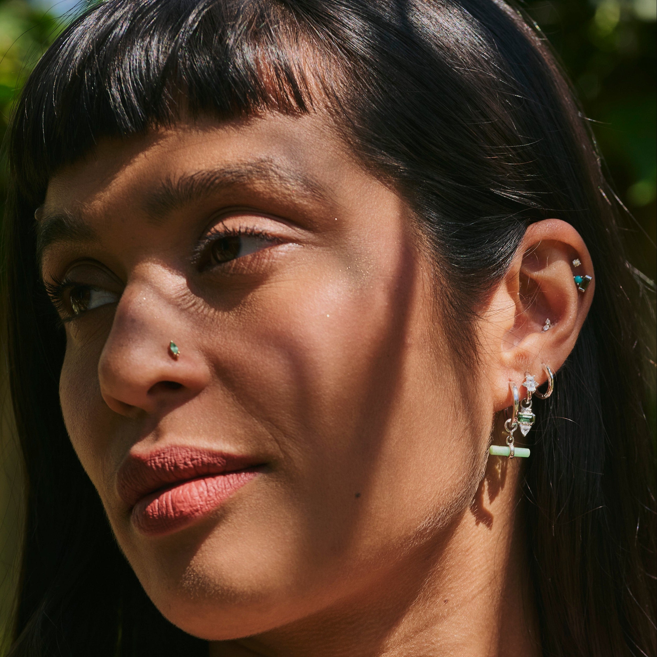 model wearing silver ear stack including the Chrysoprase T-Bar Earring Charm Sterling Silver