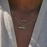 model wearing t-bars layered including the Chrysoprase T-Bar Pendant 9k Gold
