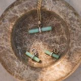 Chrysoprase T-Bar Pendant 9k Gold and matching charms in stone dish