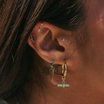 ear close up wearing the Chrysoprase T-Bar Hoop Earrings 9k Gold and other solid gold earrings