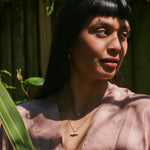 model wearing Chrysoprase T-Bar Pendant Sterling Silver along with other silver pieces